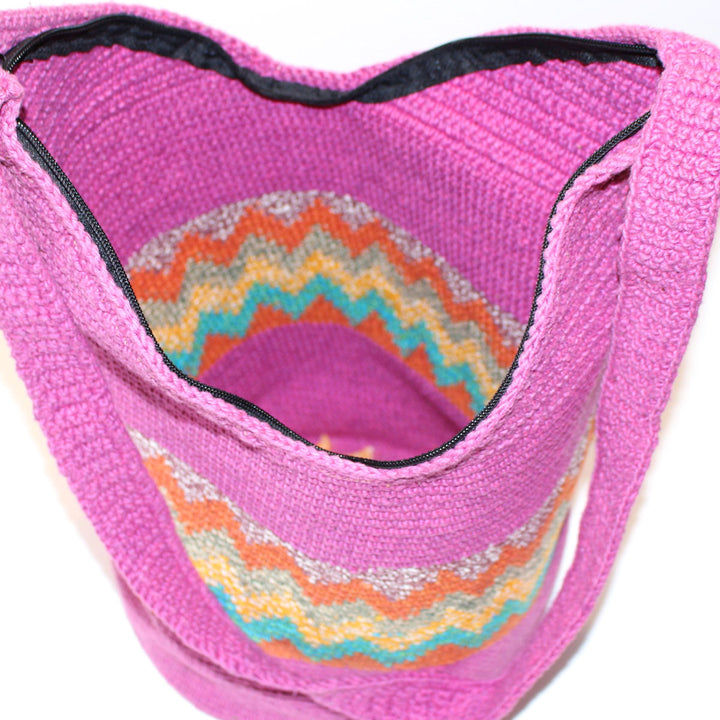top view of pink woven bag large purse