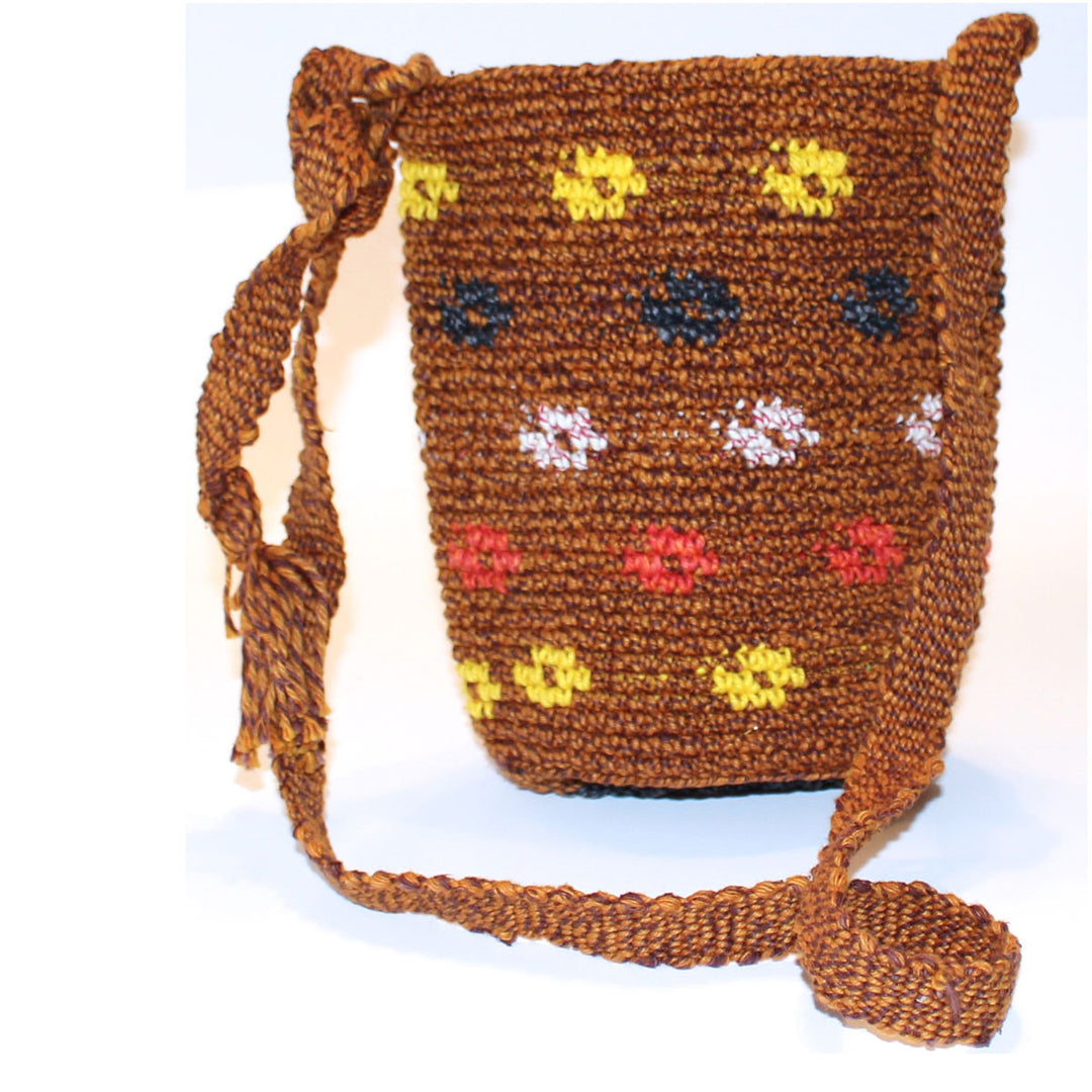 Brown Mayan woven bag with open top and adjustable length strap and round bottom - brown background with yellow, orange, black, and white ring design