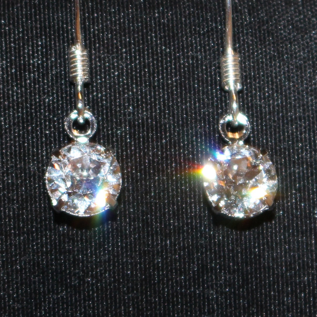 Natural Artist crystal earrings with silver metal close up